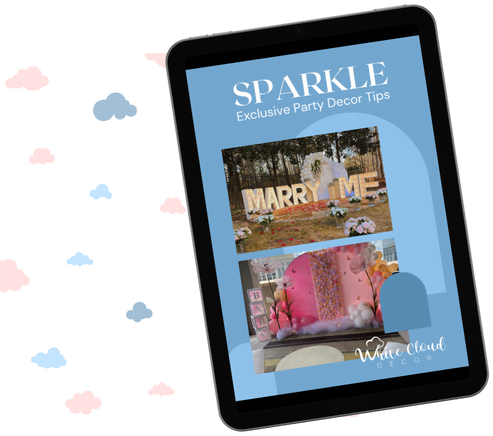 A tablet displaying a page from a party decor magazine titled "sparkle" with an image of a "marry me" sign, surrounded by pastel-colored clouds.